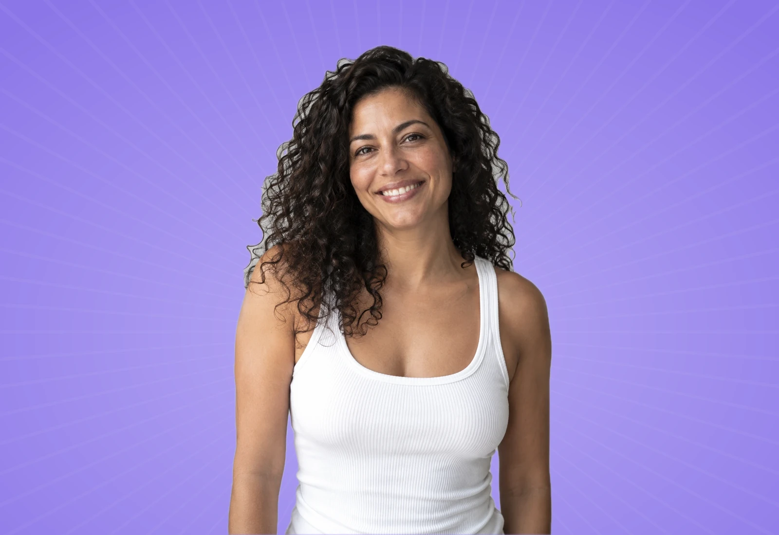 Smiling woman with curly hair on a lavender background